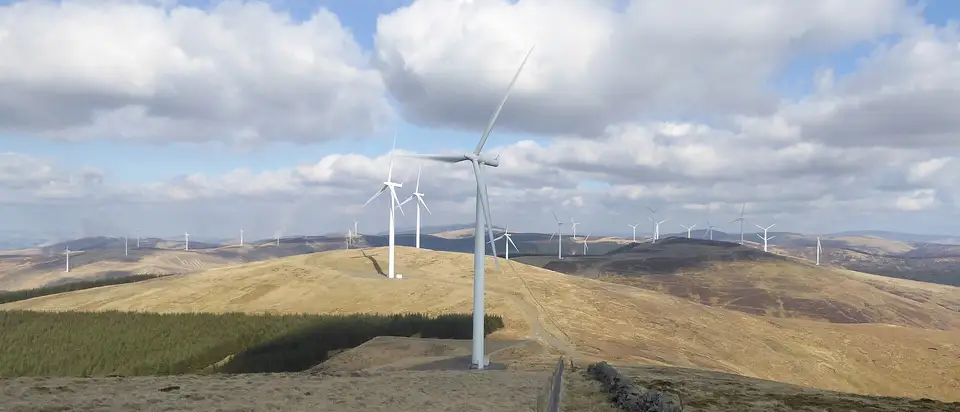 Wind turbines along the top of Hawkwood Hill at Clyde Wind Farm in the Southern Uplands of Scotland.